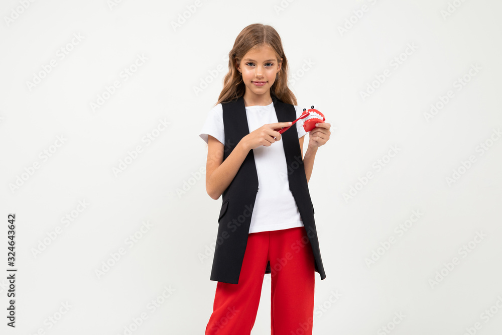 Pretty girl in black and red costume isolated on white background Pretty girl in black and red costume isolated on white background