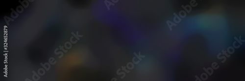 blurred bokeh landscape format background texture with very dark blue, very dark violet and black colors and free text space