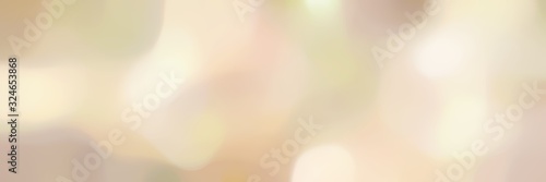 unfocused bokeh landscape format background with wheat, beige and tan colors space for text or image