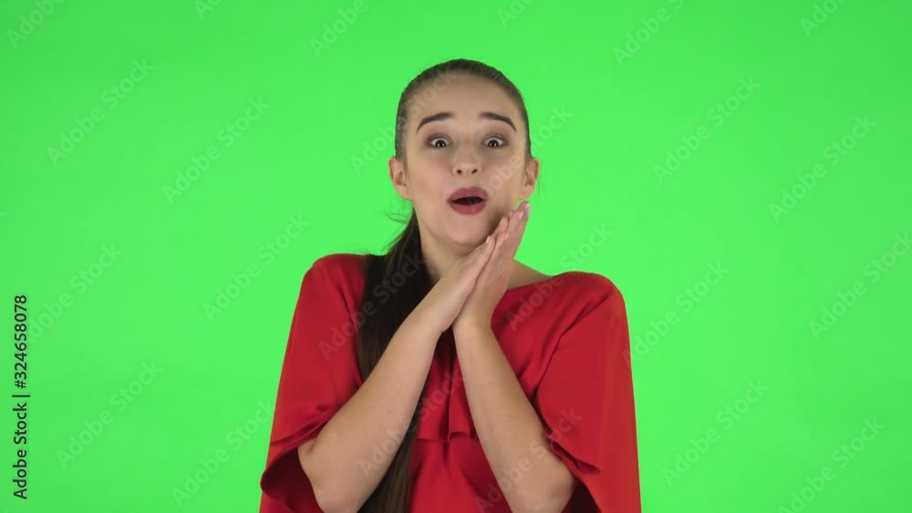 Portrait of pretty young woman with surprised and shocked wow face expression. Green screen Portrait of pretty young woman with surprised and shocked wow face expression. Green screen