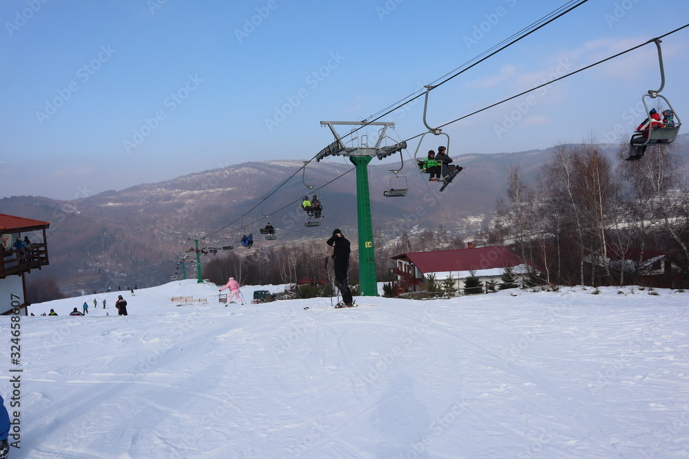 people enjoy outdoor activities in the mountains, skiing and snowboarding