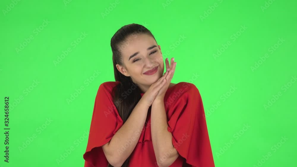 Portrait of pretty young woman with surprised wow face expression and tender smiling. Green screen Portrait of pretty young woman with surprised wow face expression and tender smiling. Green screen