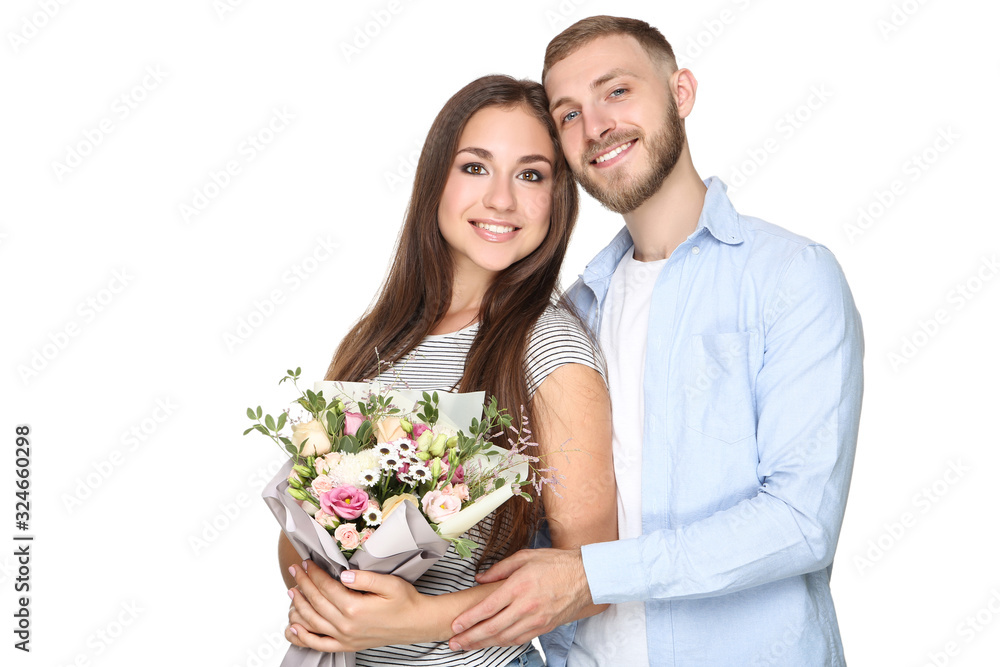 Happy young couple with bouquet of flowers on white background Happy young couple with bouquet of flowers on white background