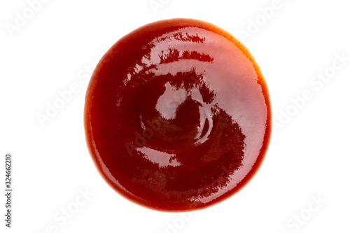 Drop of barbecue sauce or ketchup isolated on white background, top view, close up.