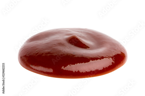 Drop of barbecue sauce or ketchup isolated on white background, top view, close up.