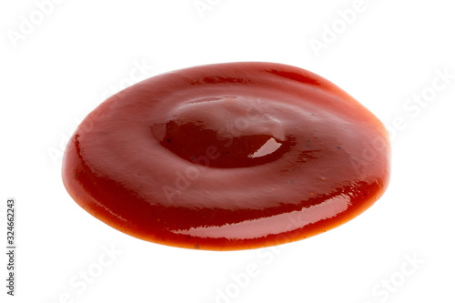 Drop of barbecue sauce or ketchup isolated on white background, top view, close up.