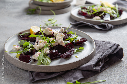 Cuadro en lienzo Beetroot cheese salad carpaccio with arugula and lemon