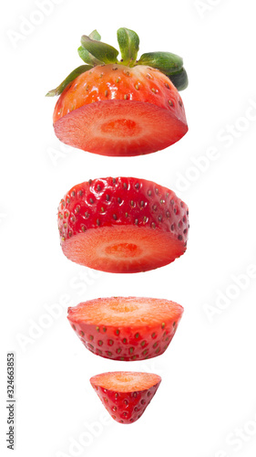 strawberry slices vertically above each other on a white isolated background