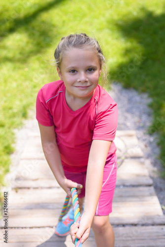 Smiling little girl climbing on outdoor playground  © oksanatrautwein