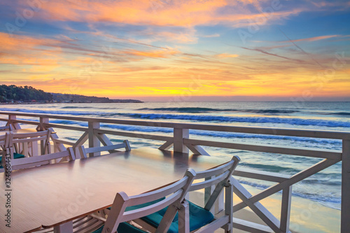 Seaside landscape - the cafe on the embankment with views of the sunrise over the sea  city of Varna  on the Black Sea coast of Bulgaria