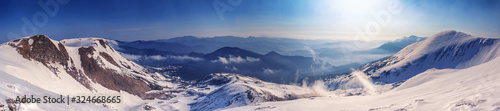 Winter landscape  panorama  banner - top view of the mountain range of the Carpathian mountains  in Ukraine