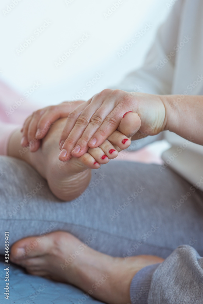 Hand making thai feet massage. Alternative medicine and thai massage concept Hand making thai feet massage. Alternative medicine and thai massage concept