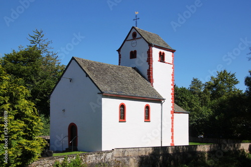 Small romanesque village church of Gentingen, Eifel region in Germany