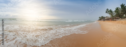 Beautiful landscape of sunrise over the sandy ocean beach at Sri Lanka