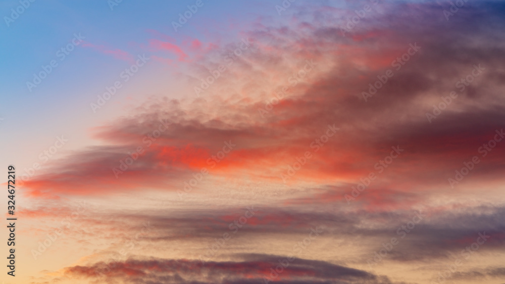 Beautiful orange, red and blue sky with clouds at sunset. Travel destination Russia