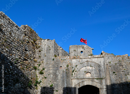 Albanian flag over Rozafa Fortress  in Shkoder(Shkodra), Albania. photo