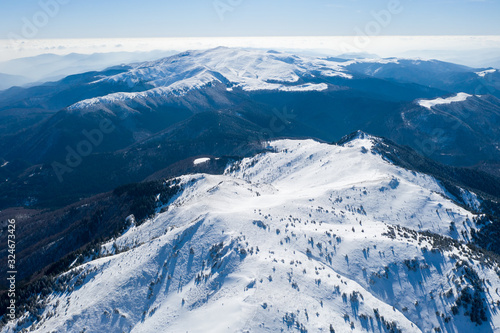 Aerial drone panorama of Ciucas Mountains in winter season.