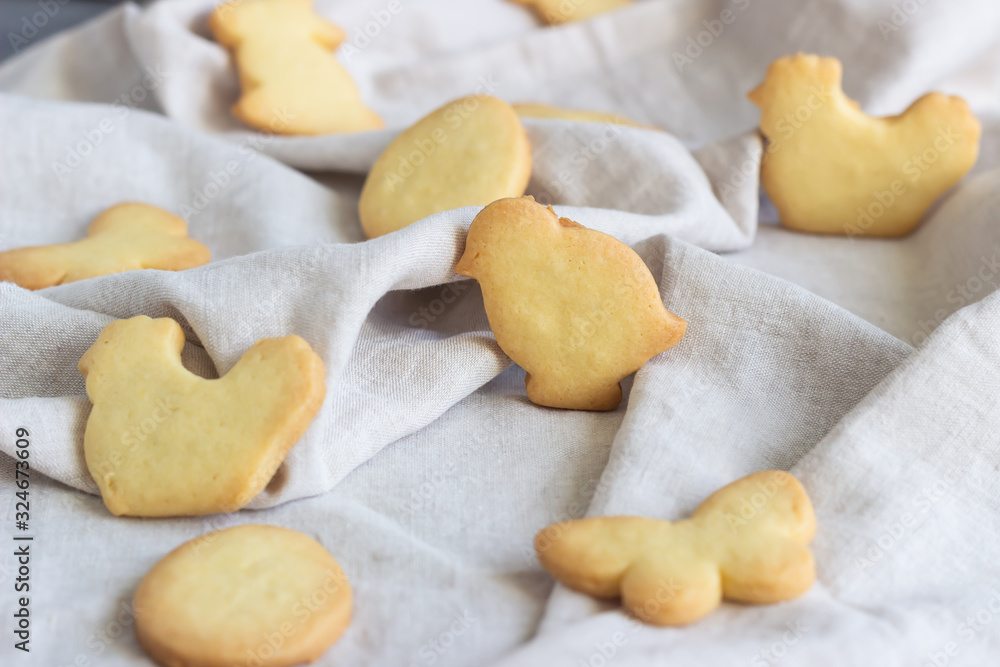 Easter cookies on a grey linen napkin. Homemade butter and sugar cookies. Easter cookies on a grey linen napkin. Homemade butter and sugar cookies.