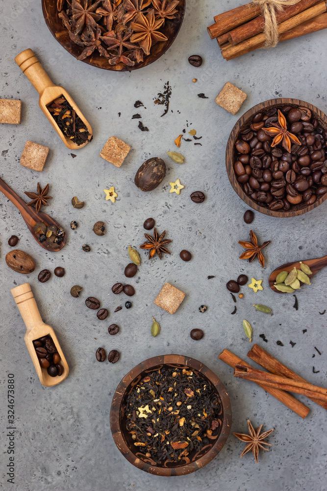 Ingredients for making spicy Indian masala chai tea or coffee. Dried black  tea, roasted coffee beans,