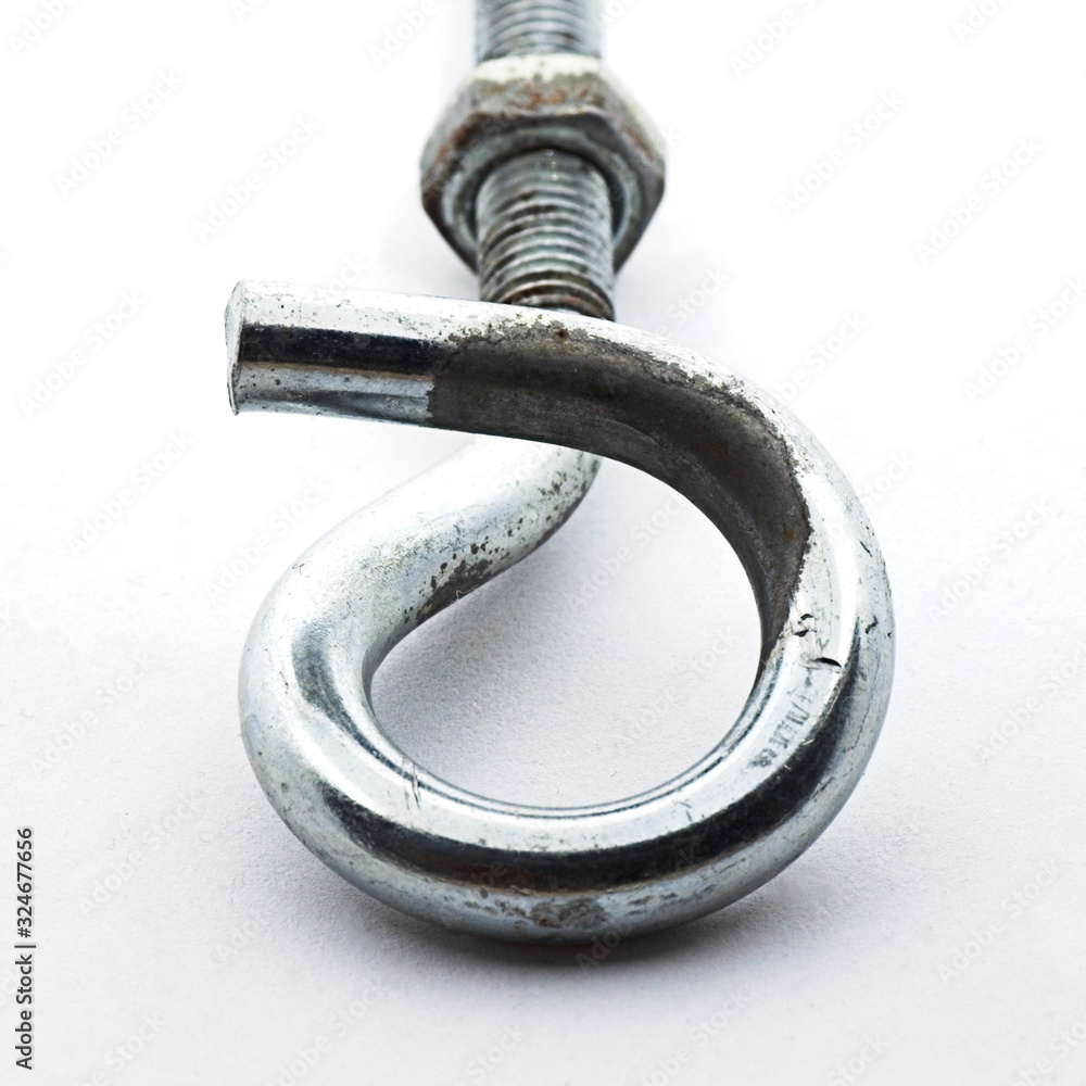 Steel pigtail screw hook on white background. Safety piece of hardware. Steel pigtail screw hook on white background. Safety piece of hardware.