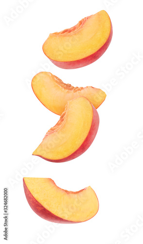 Isolated peach slices. Four wedges of raw peach fruits isolated on white background with clipping path