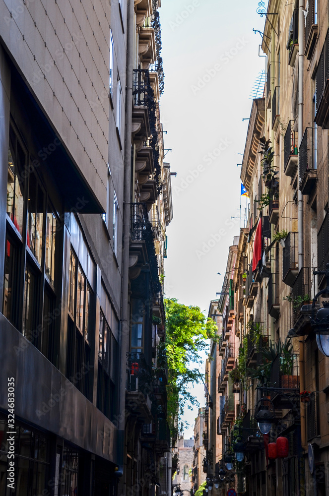 Narrow street in the Gothic Quarter of Barcelona. The Gothic Quarter is the centre of the old city of Barcelona. Architecture and details, street view