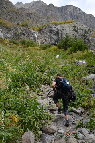 Mazeri region, Svaneti, Georgia - September 29, 2019: Tourist is hiking to Mazeri Waterfall