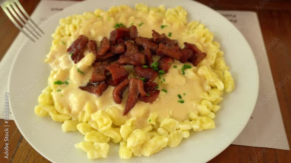 Spatzle with cheese and beef jerky, traditional Swiss dish prepared in Pozuzo, Peru Spatzle with cheese and beef jerky, traditional Swiss dish prepared in Pozuzo, Peru