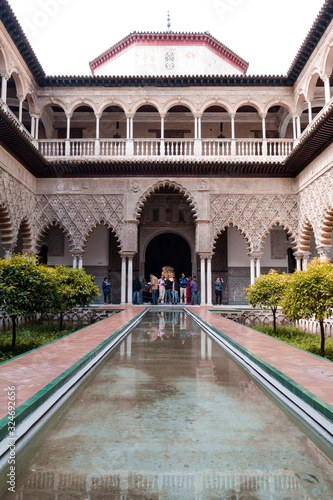 Alcazar of Seville fountain at cloudy day , Seville , Spain