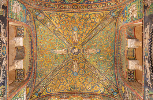 RAVENNA, ITALY - JANUARY 28, 2020: The ceiling symbolic mosaic with the Lamb of God in the center from the presbytery of church Basilica di San Vitale from the 6. cent.