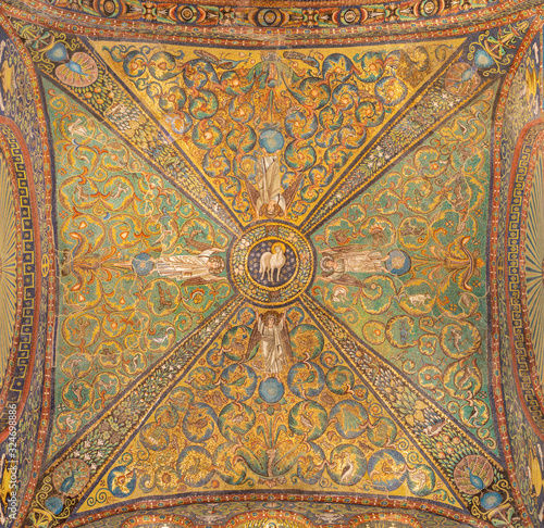RAVENNA, ITALY - JANUARY 28, 2020: The ceiling symbolic mosaic with the Lamb of God in the center from the presbytery of church Basilica di San Vitale from the 6. cent.