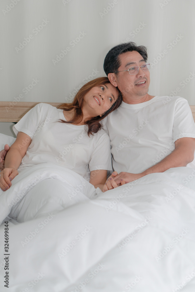 asian couple happy together on bed in morning asian couple happy together on bed in morning