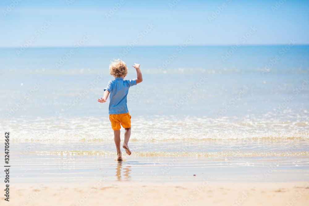 Kids playing on beach. Children play at sea. Kids playing on beach. Children play at sea.