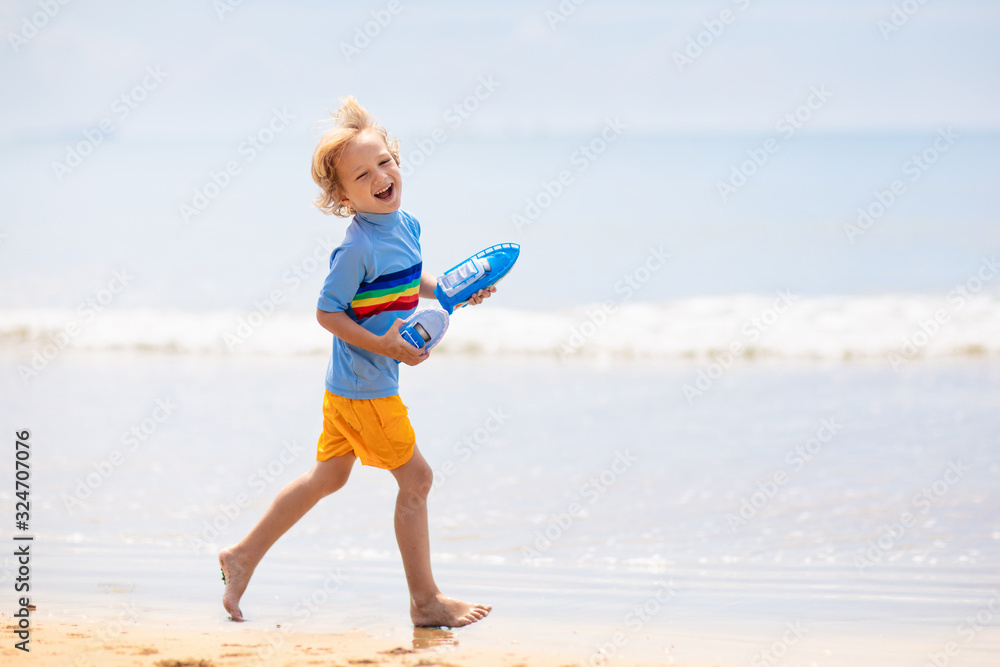 Kids playing on beach. Children play at sea. Kids playing on beach. Children play at sea.