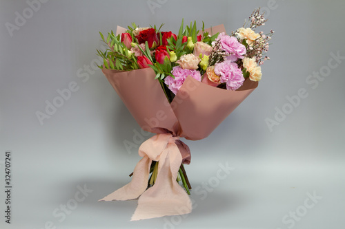 Beautiful bridal bouquet in retro style, light gray background, selective focus