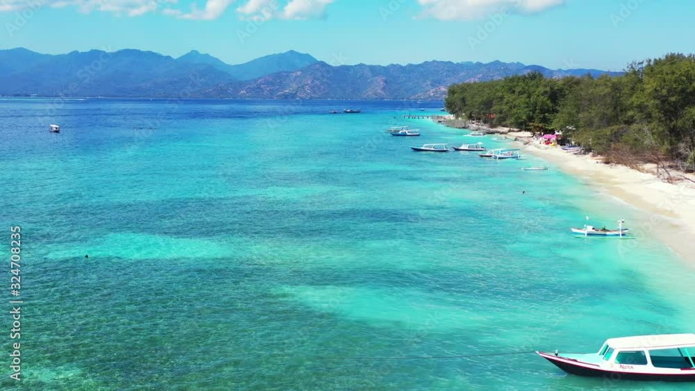 summer vacation background. perfectly clear turquoise sea, white sand beach and small fishing boats. summer vacation background. perfectly clear turquoise sea, white sand beach and small fishing boats.
