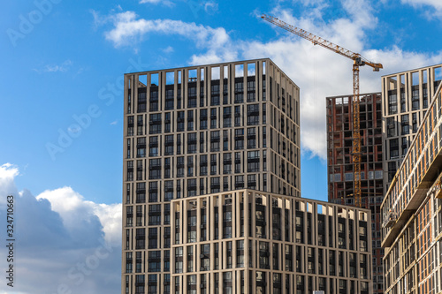 Construction of a modern residential complex. The construction of a multi-story building. cargo crane