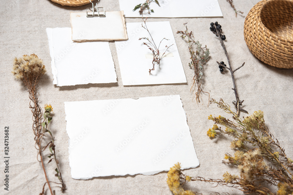 Wedding invitation mockup with dry plants , papers on textile background. Top view, flat lay. Wedding stationary. Perfect for presentation of your invitation, menu, greeting cards. Herbarium concept Wedding invitation mockup with dry plants , papers on textile background. Top view, flat lay. Wedding stationary. Perfect for presentation of your invitation, menu, greeting cards. Herbarium concept