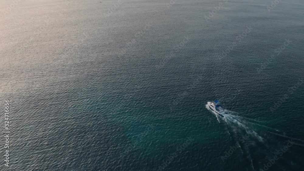 Deep sea fishing motor boat at sunrise at Watamu, Malindi, Kenya. Aerial drone view Deep sea fishing motor boat at sunrise at Watamu, Malindi, Kenya. Aerial drone view