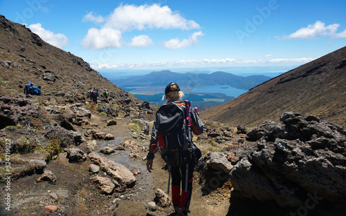 Tongariro, New Zealand - December 27, 2019 : Woman Trekking at Tongariro Alpine Crossing in New Zealand photo