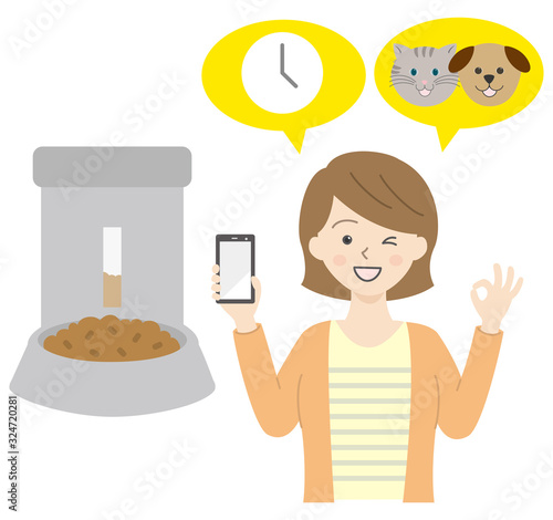 自動エサやり機とスマホを持っている女性　犬猫ペット