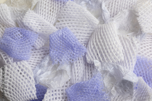 White & Purple Reticulated Styrofoam Discarded Packaging Background Texture