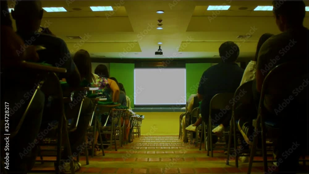 A conference room full of people. A conference room full of people.