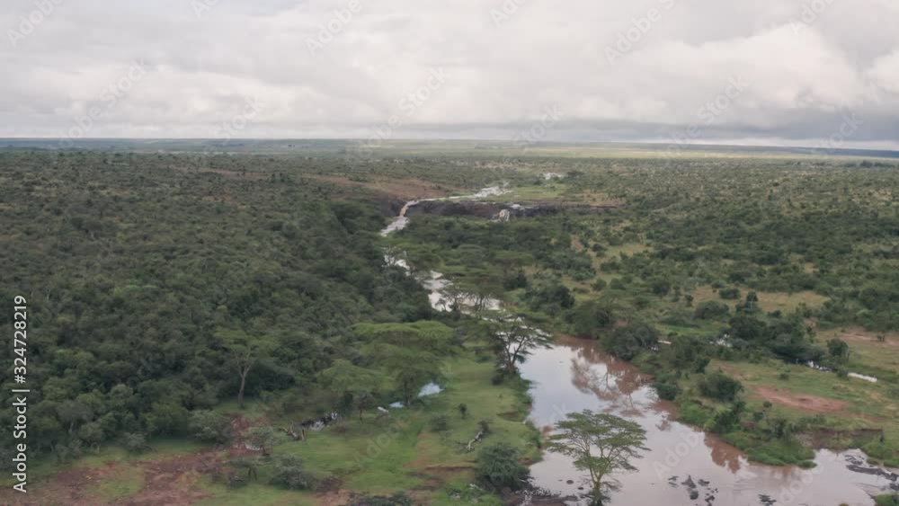 River and savanna wildlife conservation reserve in Laikipia, Kenya. Aerial drone view River and savanna wildlife conservation reserve in Laikipia, Kenya. Aerial drone view