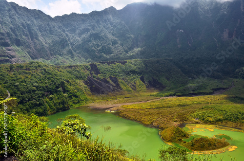 lake in mountains with green view of plants in West Java