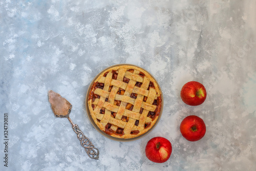 Homemade apple pie on grey concrete background,top view