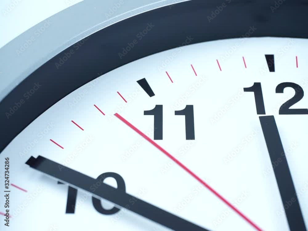 Closeup White watch Showtime 11.50 am or pm. on White background, the second hand moves slowly, Time concept. Closeup White watch Showtime 11.50 am or pm. on White background, the second hand moves slowly, Time concept.
