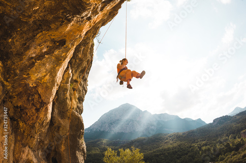 Obraz na płótnie Rock climber hanging on a rope.