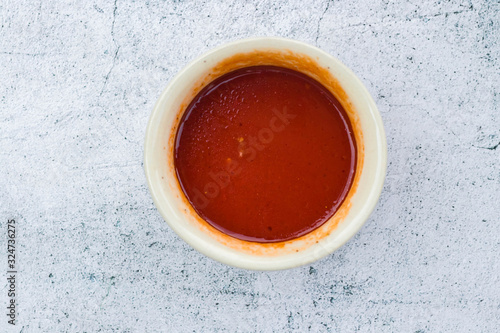 Homemade tomato chilly red paste sauce in saucepan. Vegan vegetarian diet food
