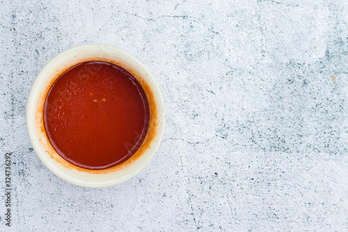 Homemade tomato chilly red paste sauce in saucepan. Vegan vegetarian diet food © Viktor Kochetkov